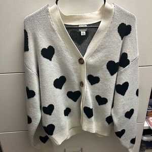 Cozy Beige Sweater with Black Heart Pattern